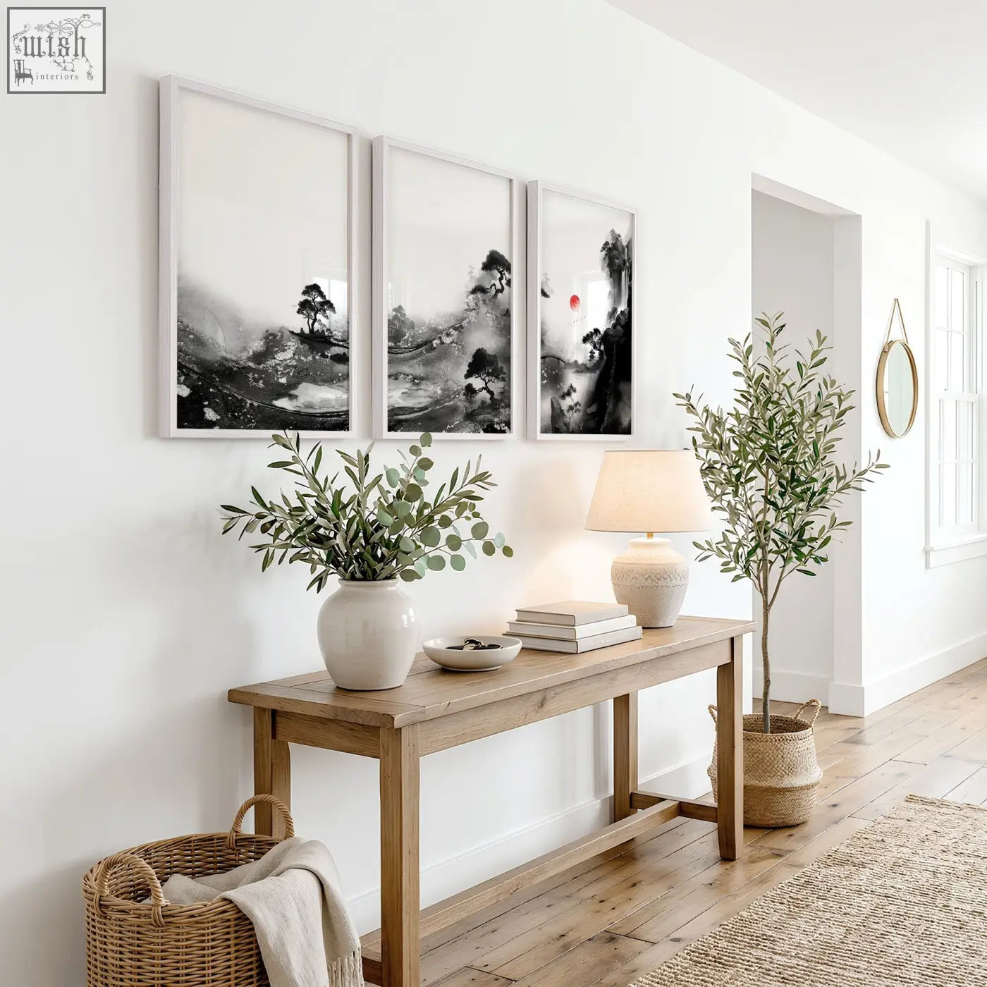 A minimalist wooden console table with natural finish holding modern japanese art prints featuring red sun and pine trees