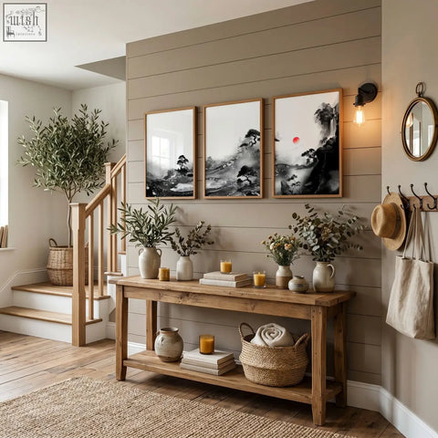 Rustic wooden console table with natural finish and open shelves holding candles and woven baskets for modern japanese art prints display