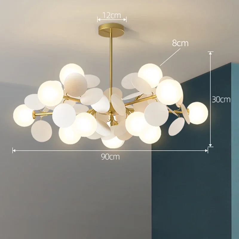 Modern led chandelier with gold-toned branches and frosted glass globe shades as a stylish light source
