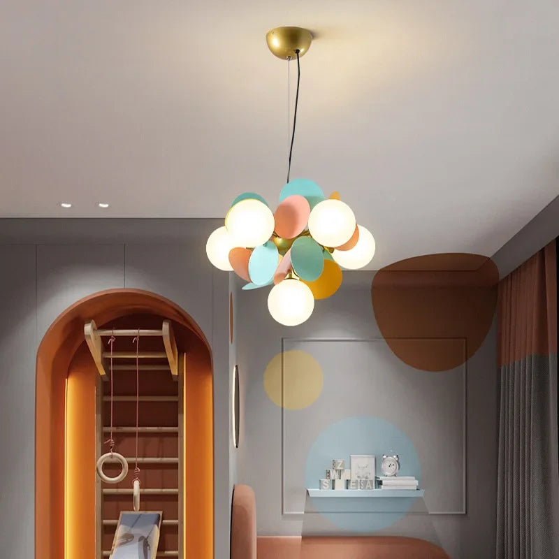 Pastel-colored spherical pendant light with brass fixture as a modern led chandeliers colorful branch lustre light source