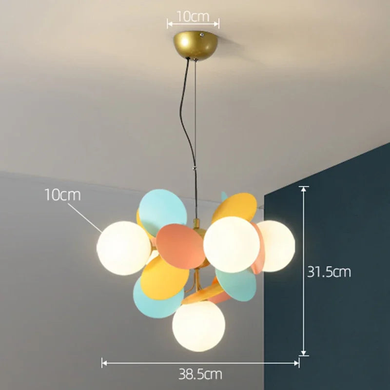 A modern led chandelier light source with colorful spherical glass shades and brass-finished ceiling mount
