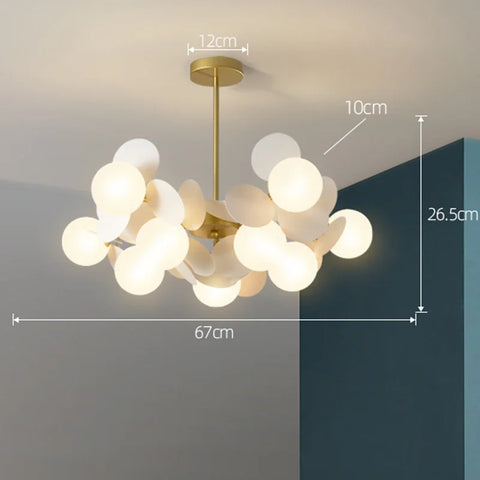 Modern led chandelier with gold-toned frame and frosted glass orbs as a stylish light source for luxury ceilings