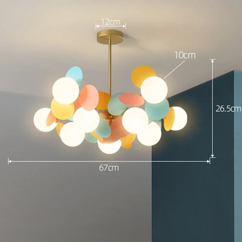 Pastel-colored spherical pendant light with brass-finished stem and rods as a colorful branch light source chandelier