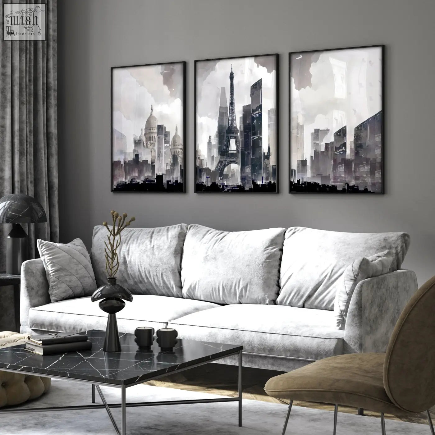 Gray velvet sofa with white cushions next to modern living room wall art paris skyline grey watercolor set of 3