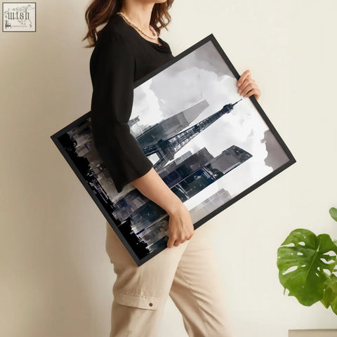 Black-framed modern living room wall art featuring a stylized eiffel tower against a grey paris cityscape
