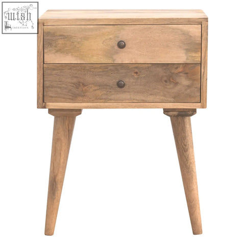 A rustic solid wood bedside table with two drawers and dark metal knobs on tapered legs for bedroom use