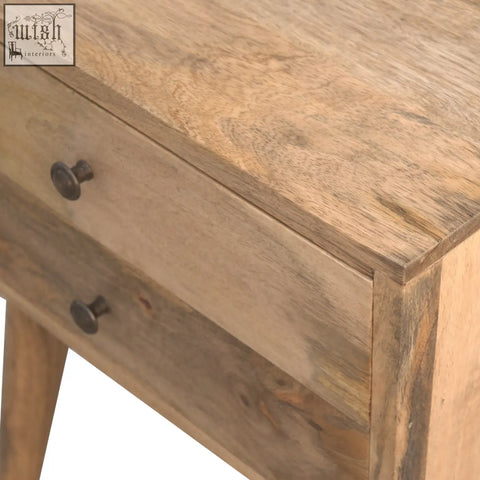 A rustic solid wood bedside table with two drawers and dark metal knobs perfect as a wood bedside table