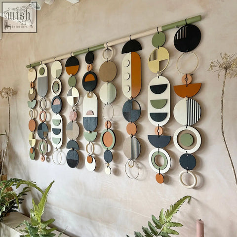 Modern wall art featuring layered circular and oval shapes in earthy tones for stylish minimal home decor