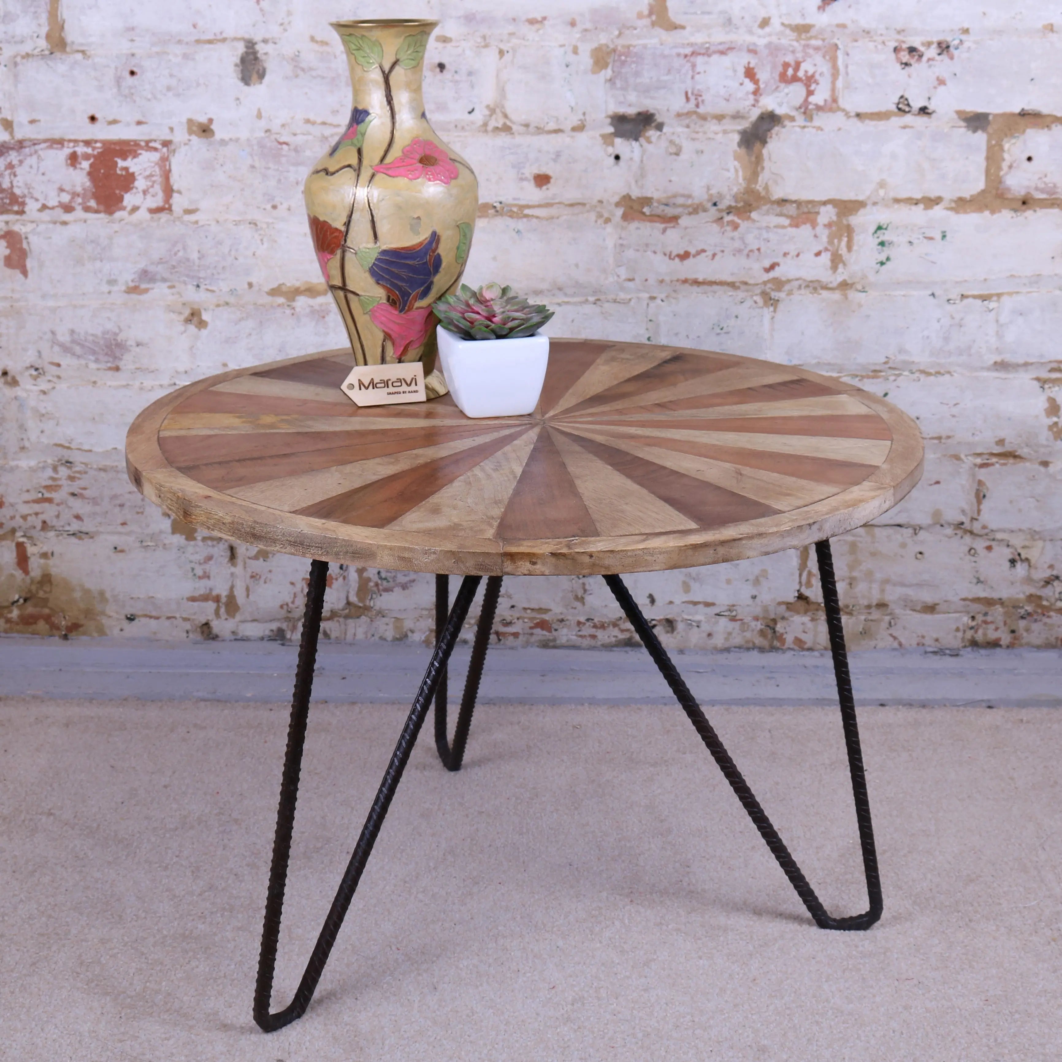 Round wooden mogas small coffee table with radial light and dark wood slats and black hairpin legs