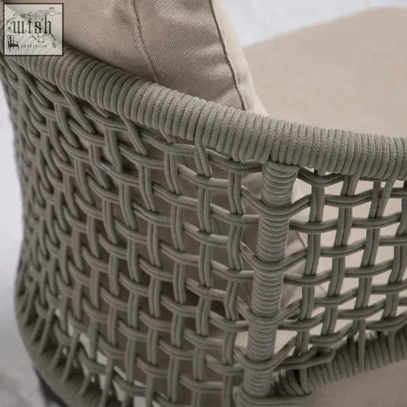Gray woven wicker mokusei chair with rope backrest and beige cushioned seat for comfy seating