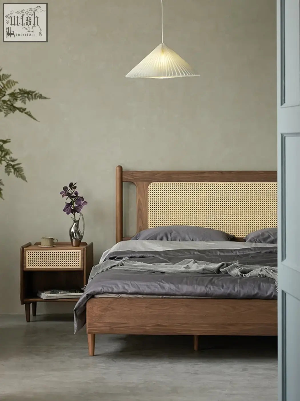 Mokuzai bed with woven cane headboard and matching nightstand in warm natural wood finish and solid construction