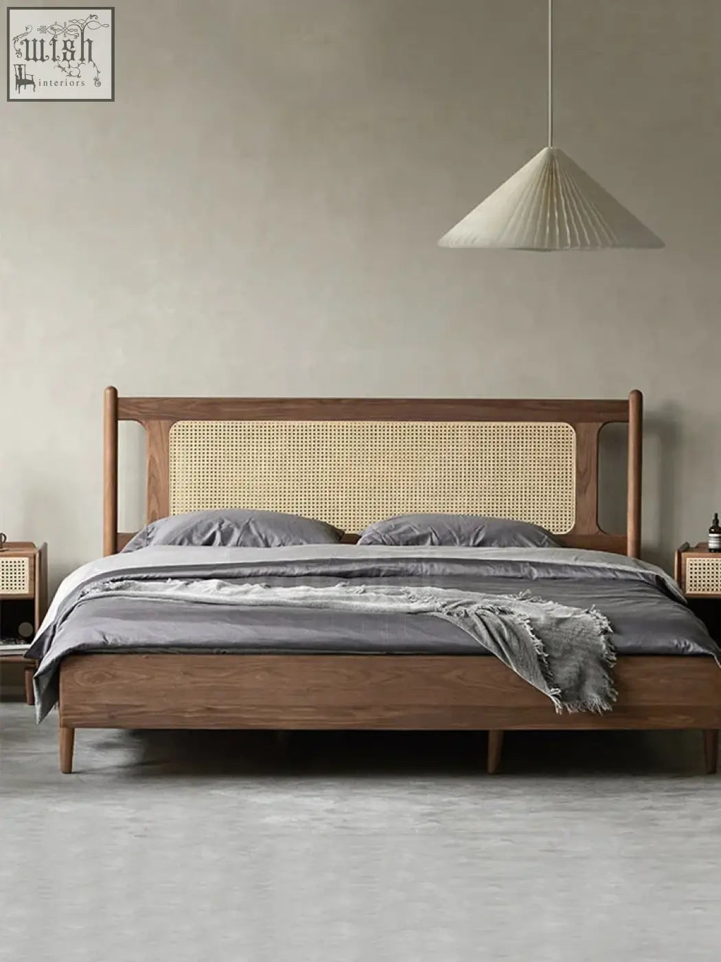 A mokuzai bed with a sleek wooden frame and rattan headboard paired with soft gray bedding and matching nightstands