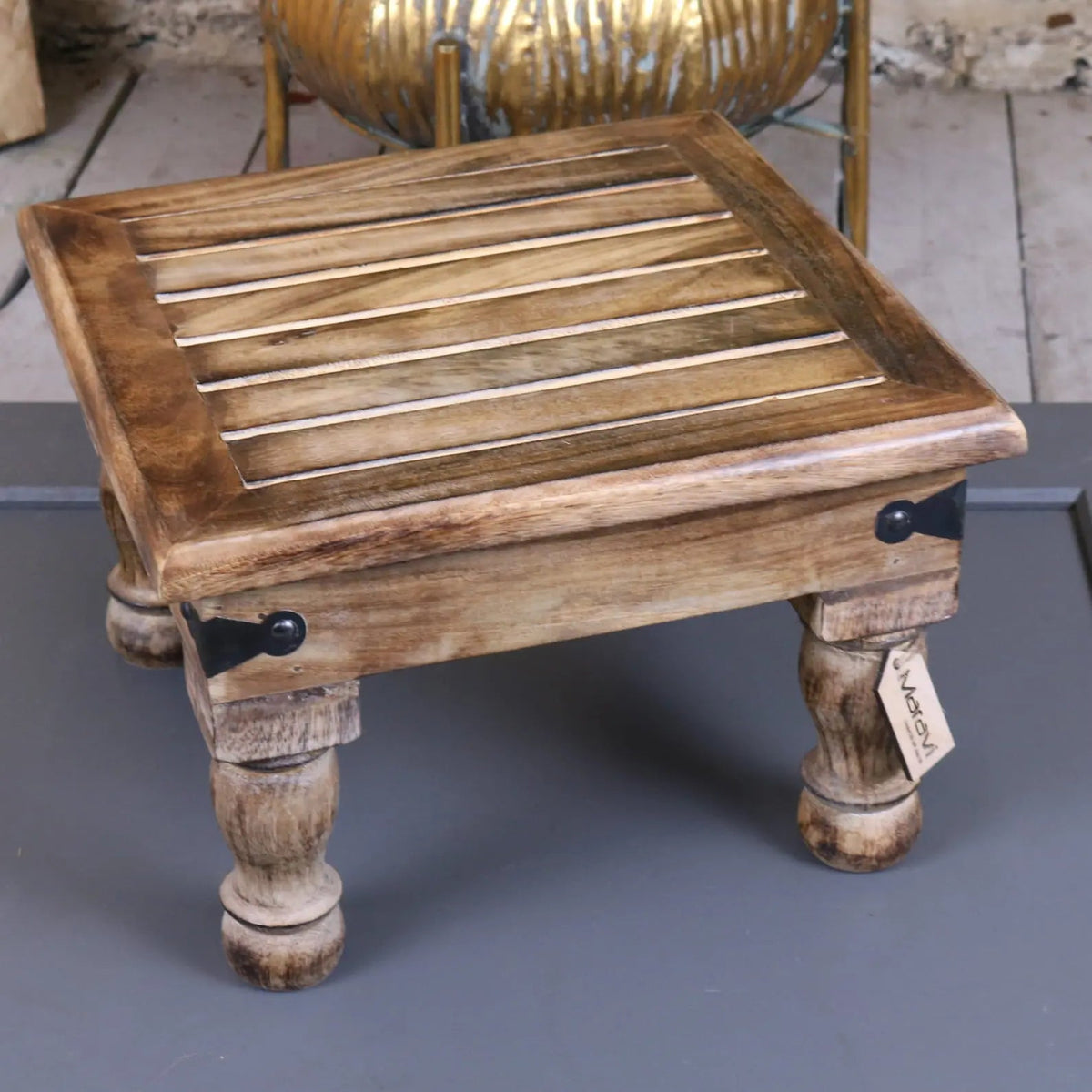 Mol mango wood stool with slatted top, turned legs, and black metal accents made from rustic mango wood