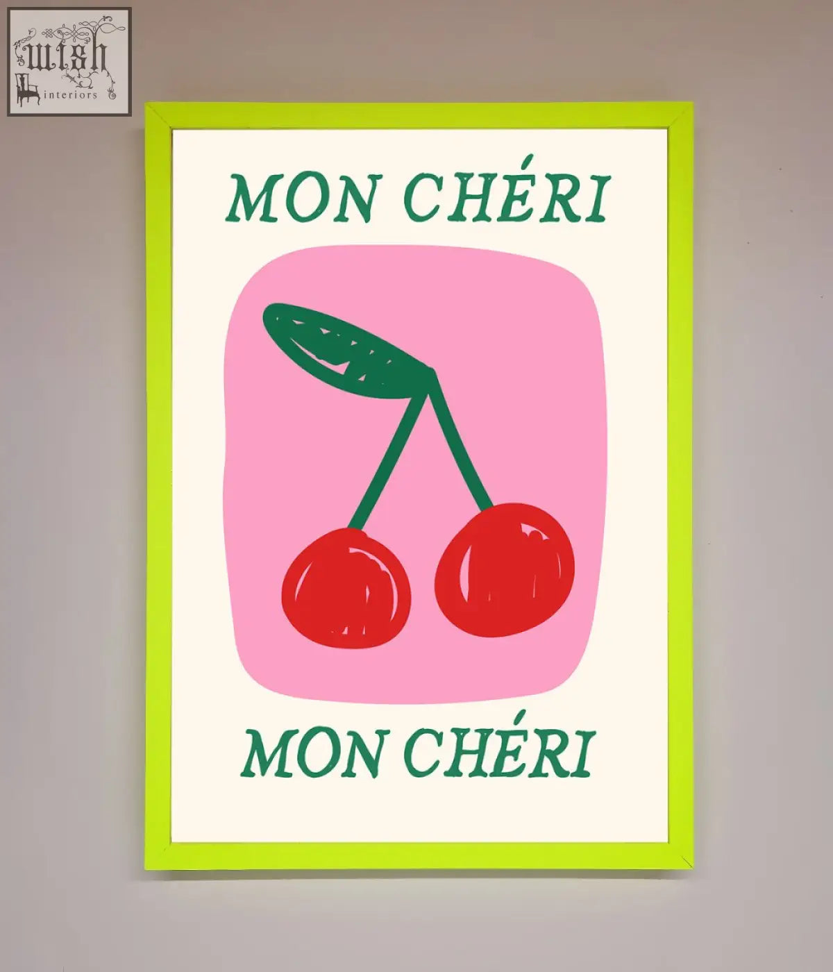 A vibrant lime green-framed mon cheri framed poster with red cherries and teal text on a pink background