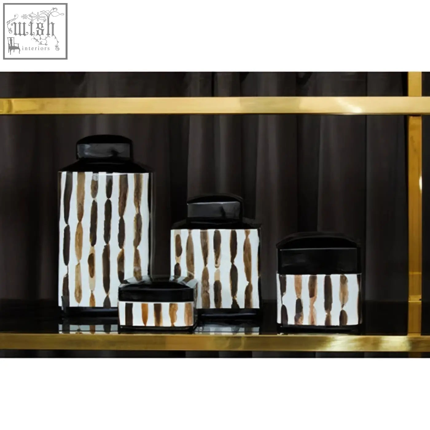 Set of four small ceramic jars with black lids and vertical brown and white striped patterns for kitchen storage