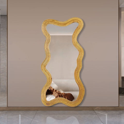Golden wavy rattan framed moniwa mirror with a modern organic design perfect for stylish home decor
