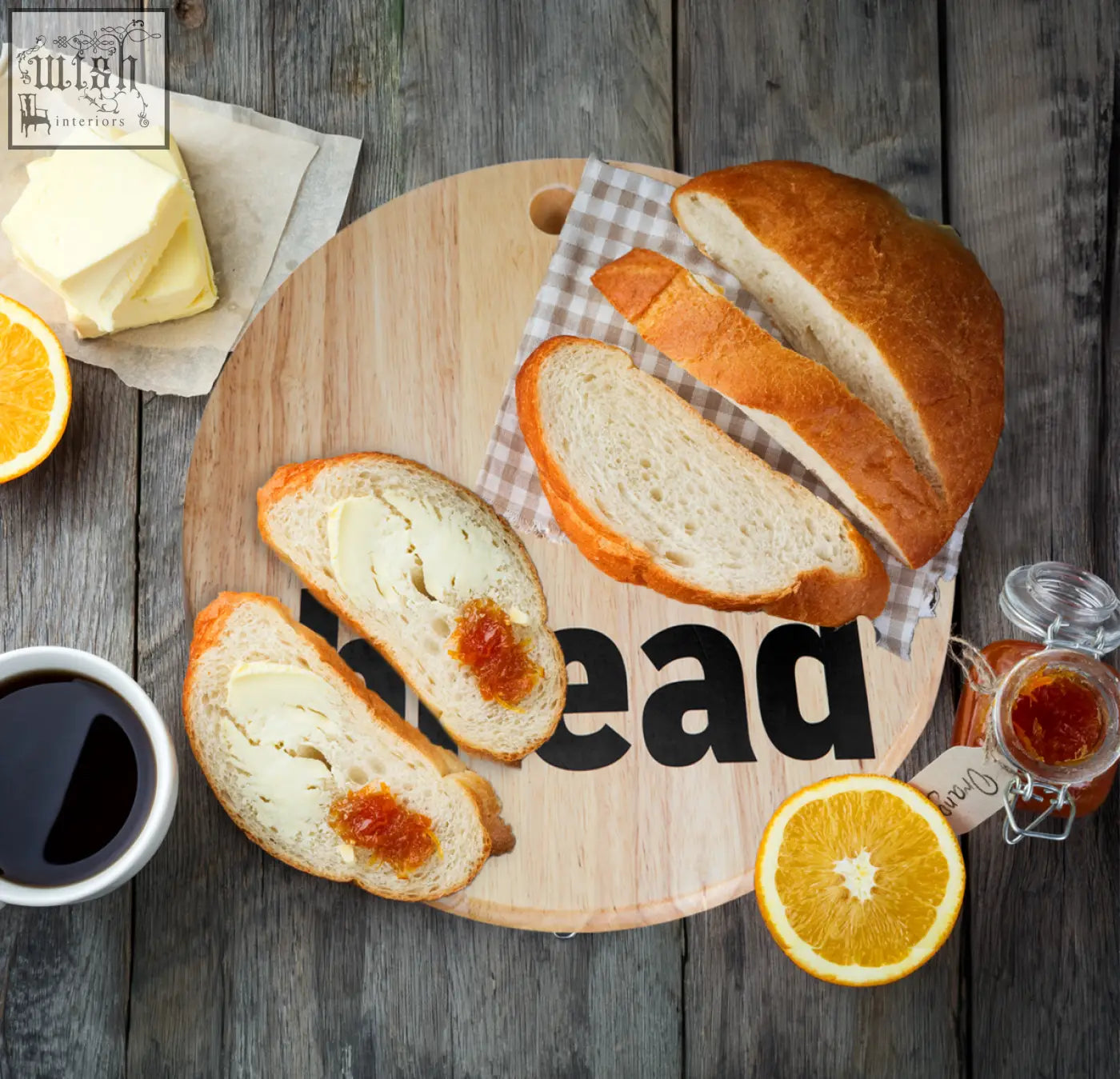 Golden brown sliced mono bread topped with butter and jam on an environmentally friendly rubberwood mono bread board