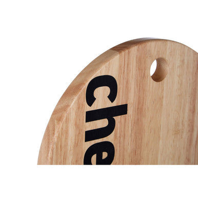 Light-colored wooden mono cheese board with circular hole and black che lettering for serving cheese