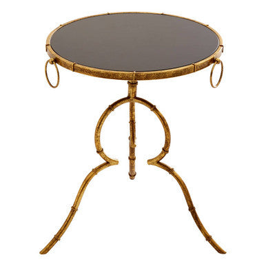 Gold-finished bamboo-style accent table with black tempered glass top and circular ring handles for stylish living spaces