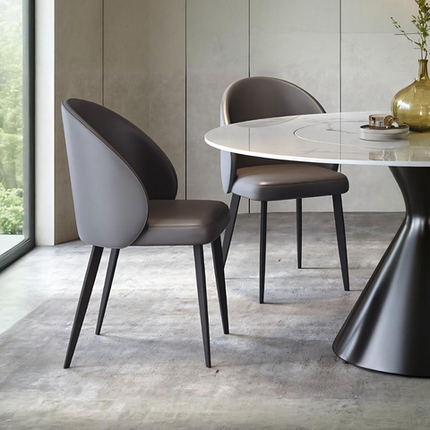 Modern gray upholstered monroe dining chair with sleek black metal legs perfect for stylish dining spaces