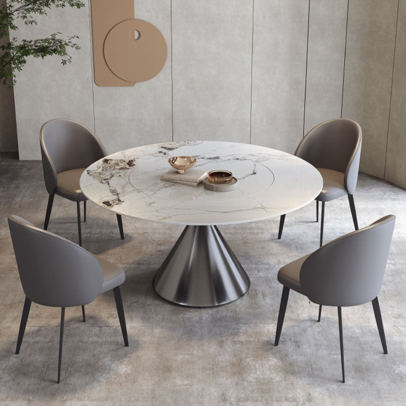 Modern round dining table with white marble top and metallic base paired with monroe dining chair