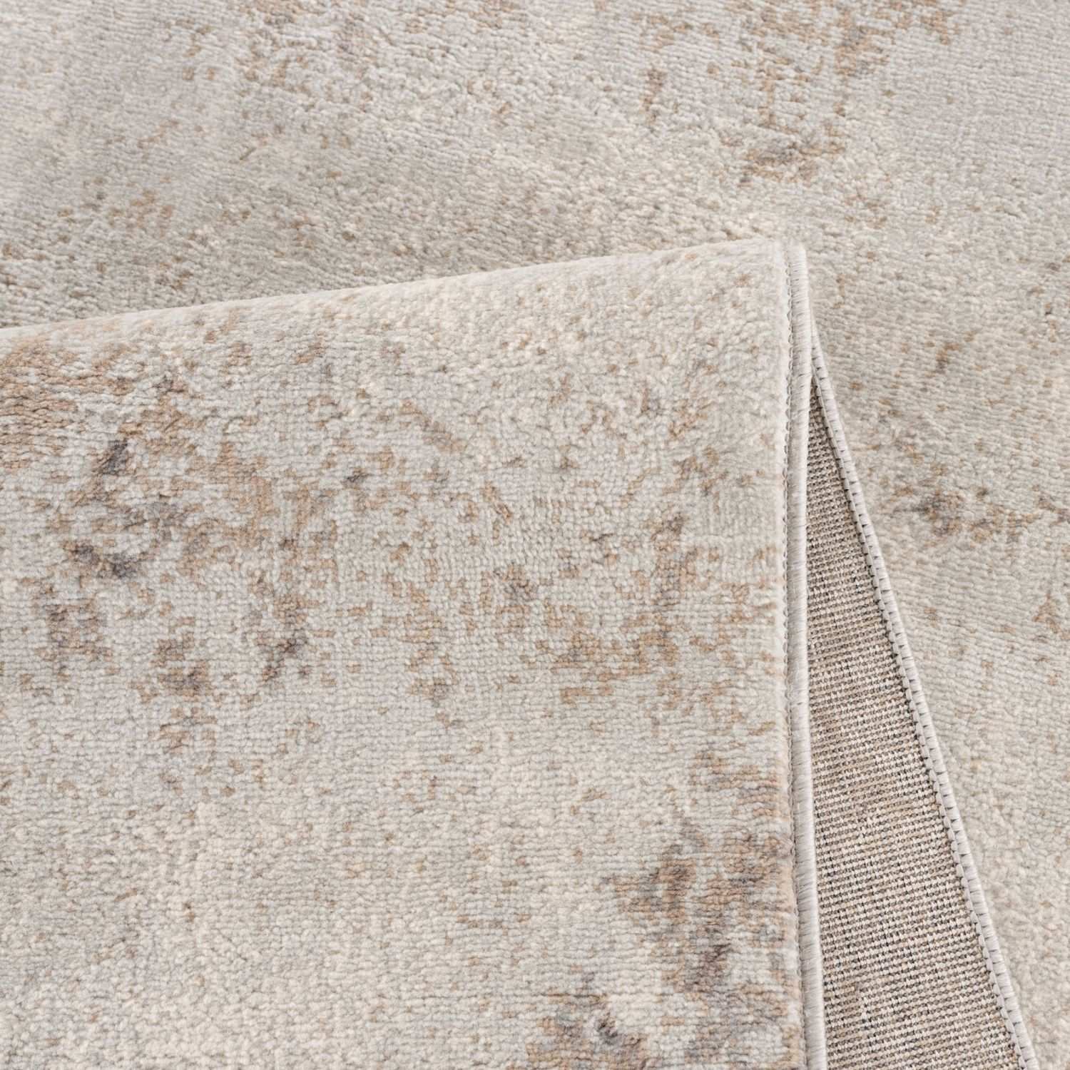 Plush beige and taupe distressed montana abstract brown rug with a textured surface for cozy living spaces