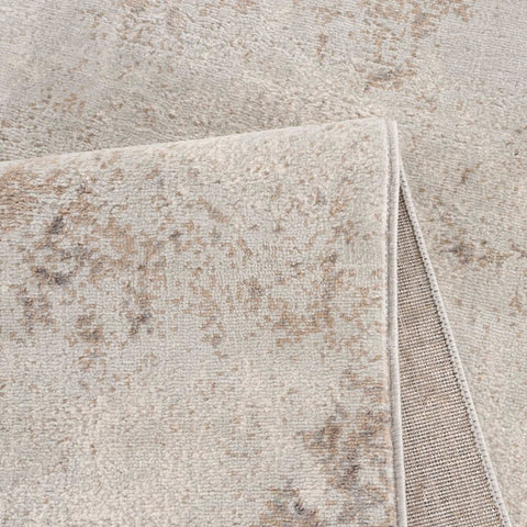 Plush beige and taupe distressed montana abstract brown rug with a textured surface for cozy living spaces