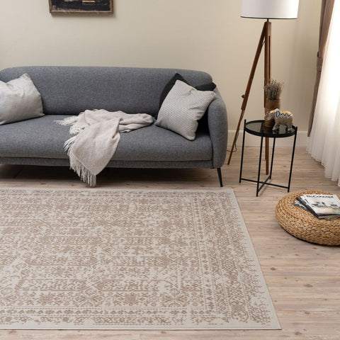 Beige rug with intricate vintage-inspired pattern in neutral montana cream tones perfect for cozy living spaces