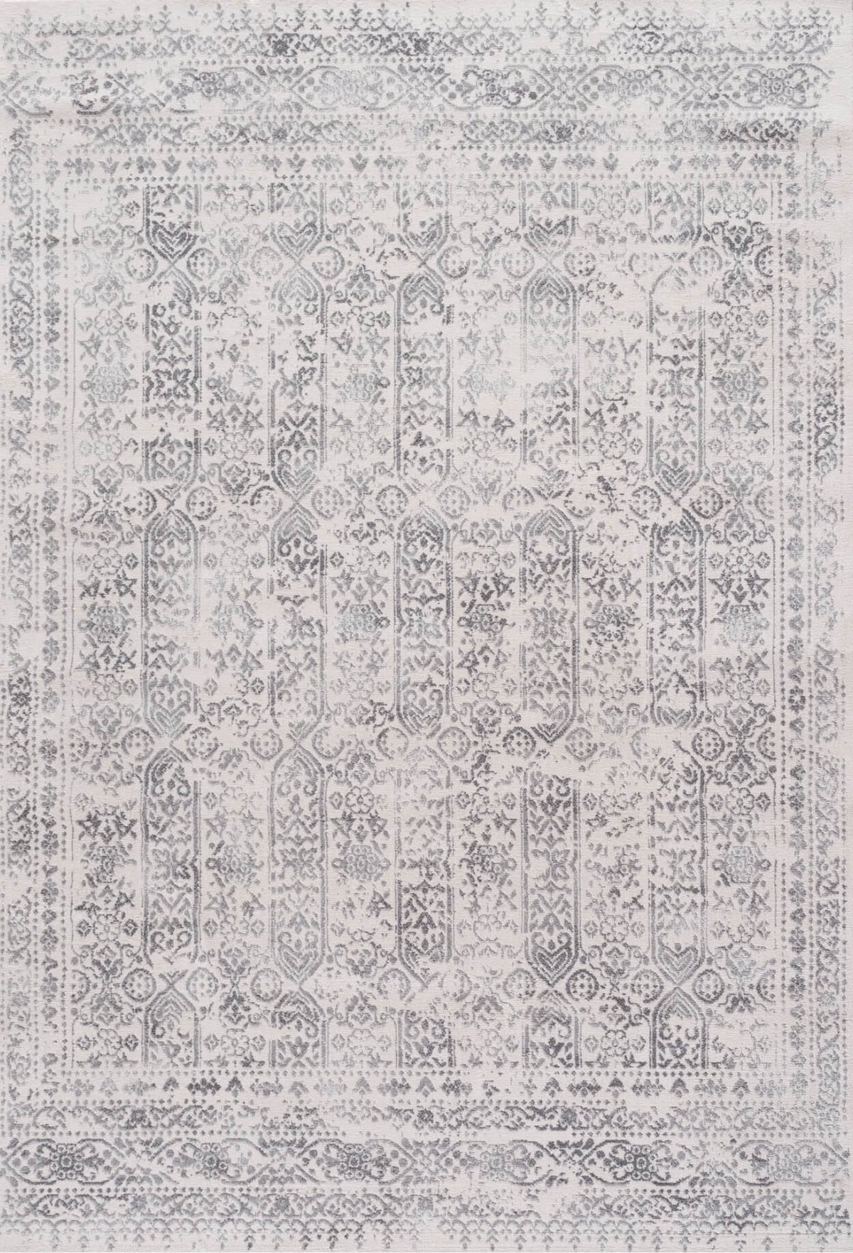Vintage-style montana cream rug with faded gray and white geometric and floral patterns in vertical columns