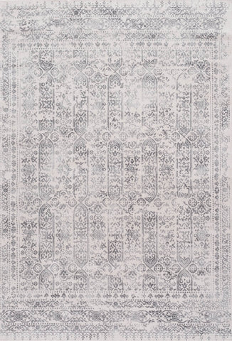 Vintage-style montana cream rug with faded gray and white geometric and floral patterns in vertical columns