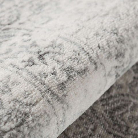 A plush off-white montana cream rug with a subtle gray vintage-inspired pattern perfect for cozy spaces