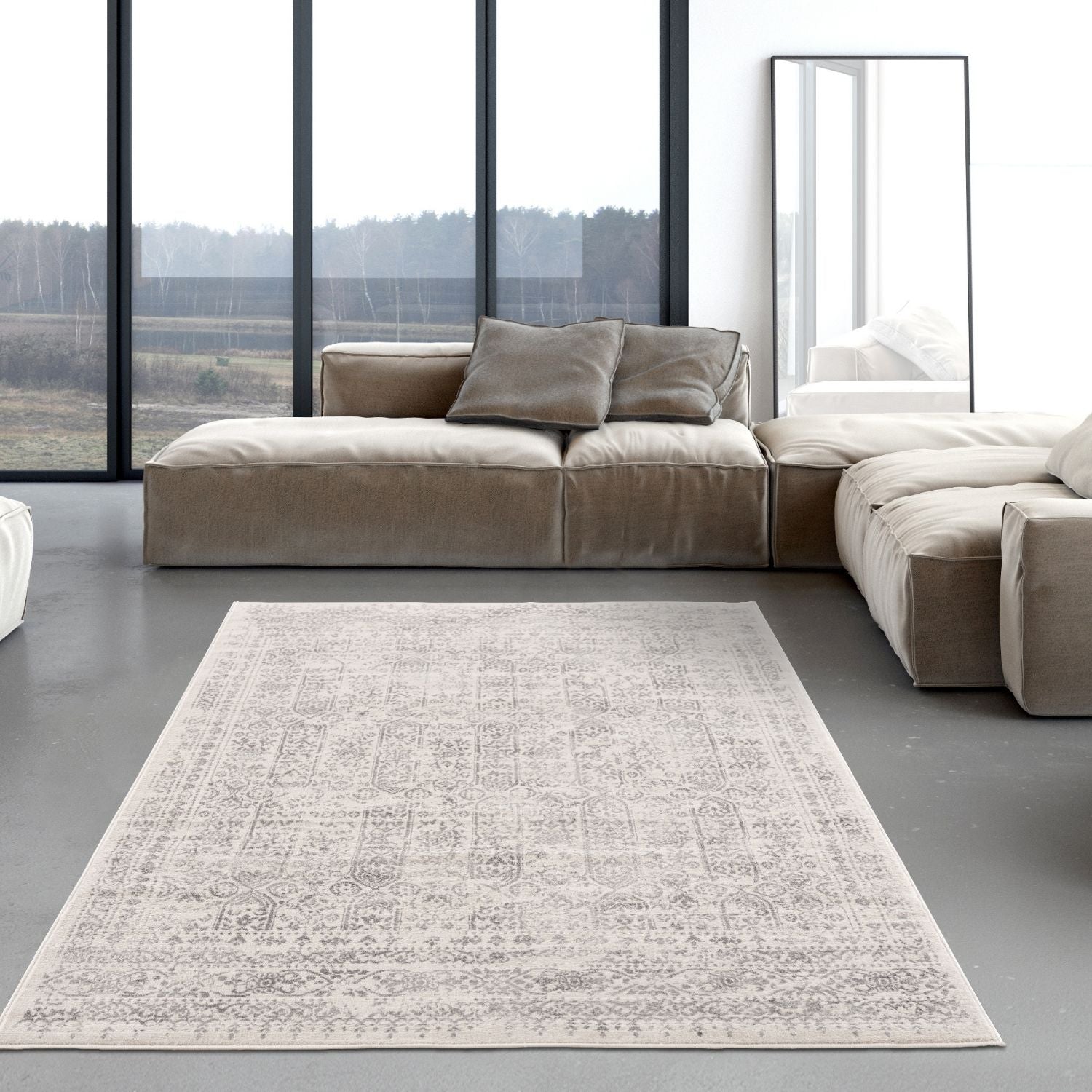A rectangular montana cream rug with beige and gray vintage pattern lies centered on the floor