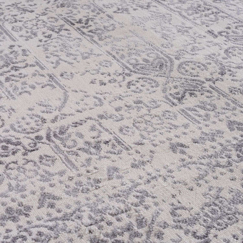 A soft cream rug with a subtle gray vintage floral and geometric pattern from the montana cream collection 3716c