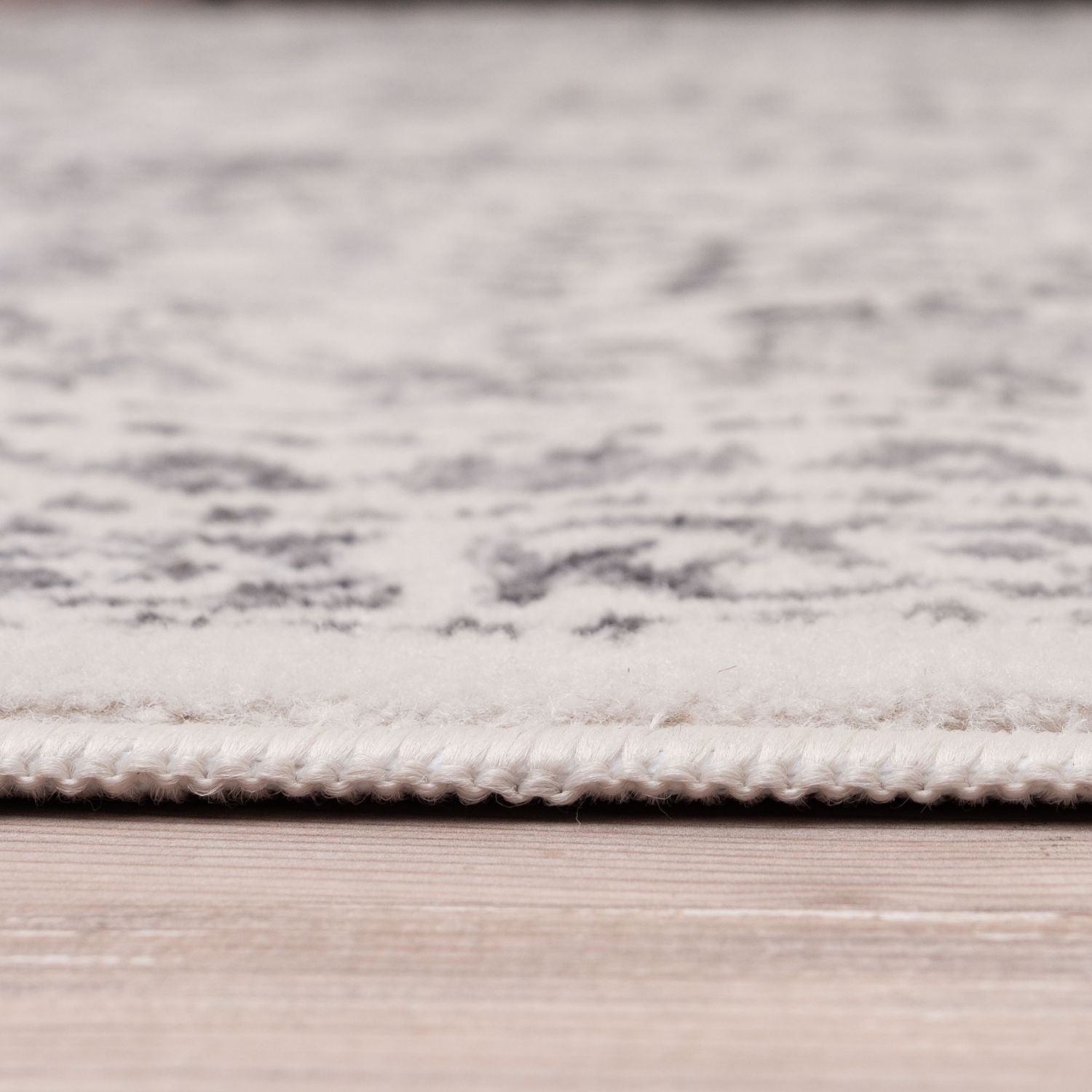 Montana cream rug with a subtle gray pattern and neatly stitched border perfect cream rug for cozy spaces