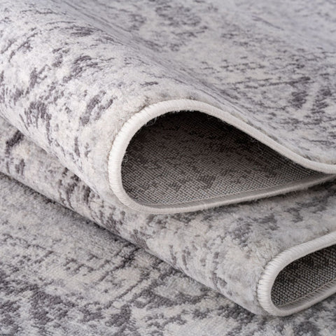A soft textured grey rug with a subtle vintage pattern from montana vintage grey rugs collection 4050
