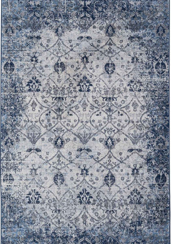 Montana vintage navy area rug with faded blue and gray damask pattern on a distressed textured surface