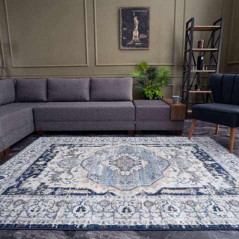 Antique-style montana vintage navy rug with faded blue and cream floral pattern and distressed vintage finish