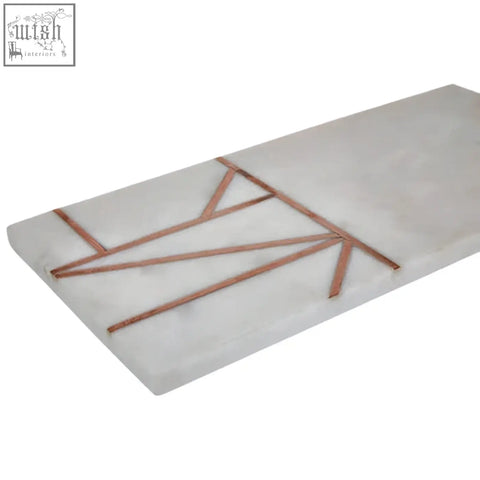 White marble tray with copper inlay geometric lines from the monzaro white marble paddle board collection