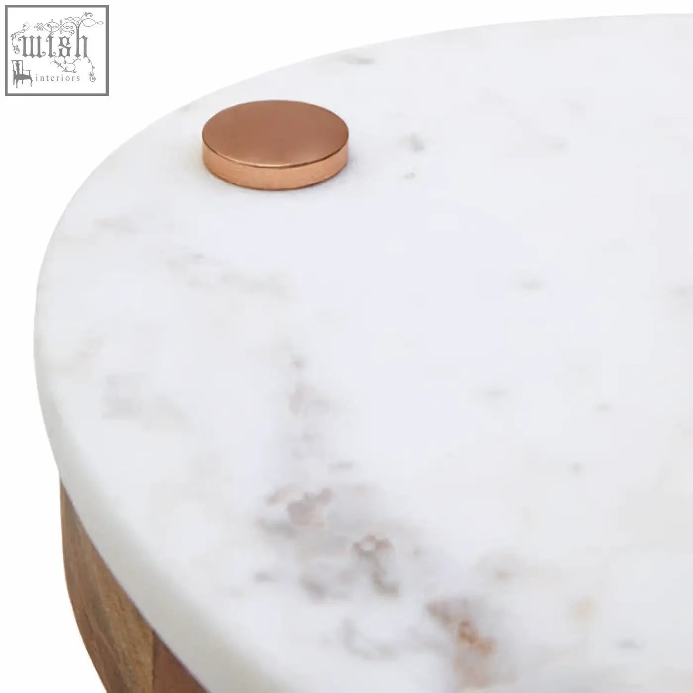 White marble coffee table with copper knob paired with wood cheese knife in monzaro cheese board set