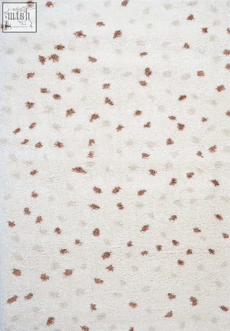Creamy plush shaggy cream terra biscotti rug with brown leaf patterns perfect for cozy home decor