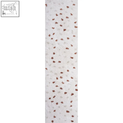 White textured rug with scattered copper metallic dots in moodi shaggy cream shaggy cream terra design