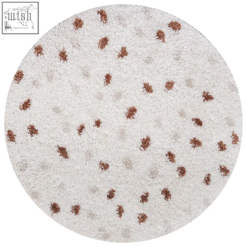 A plush moodi shaggy cream circular rug with a soft white base and brown tufted dots perfect for cozy spaces