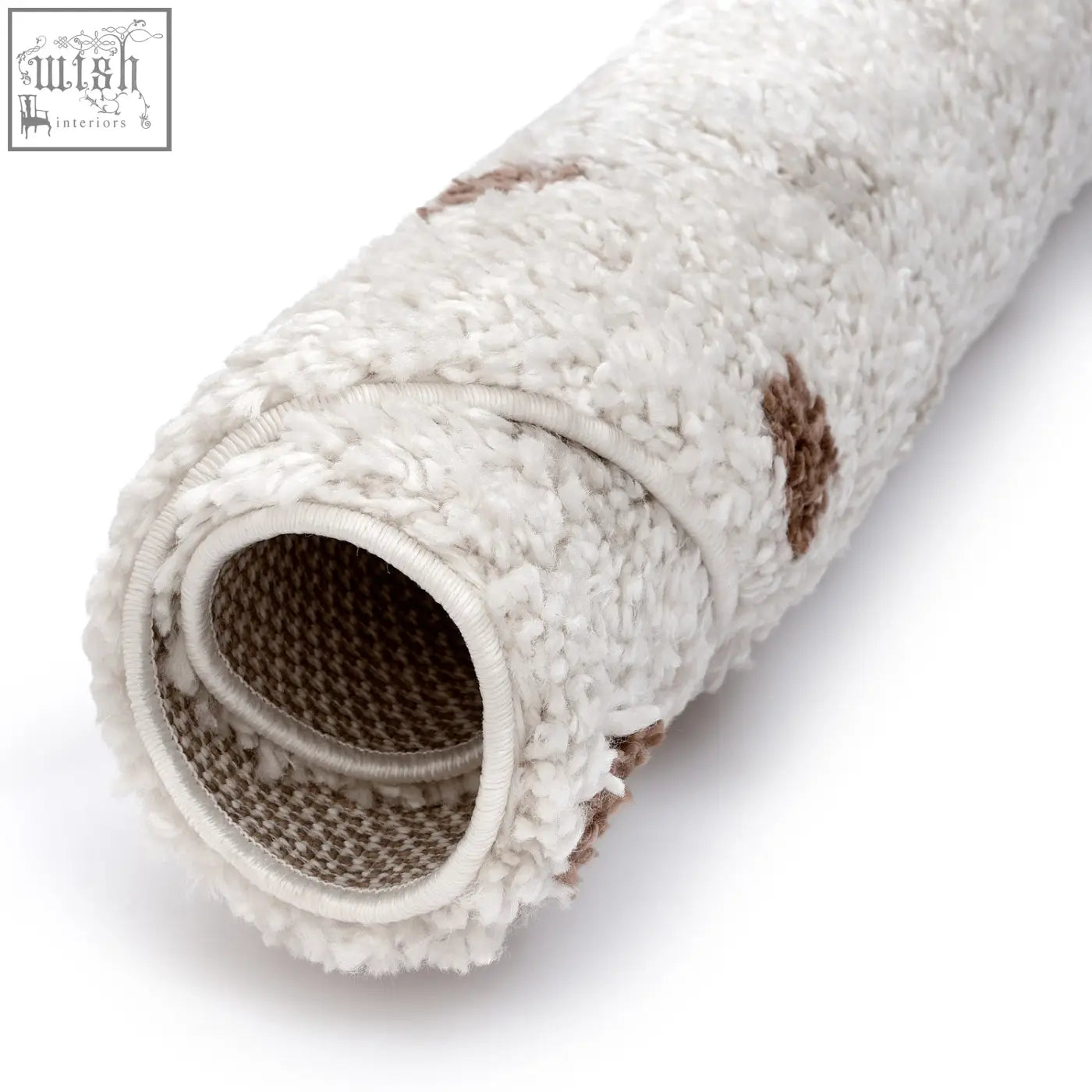 A plush moodi shaggy cream rug with brown paw prints soft texture and woven backing perfect for cozy spaces