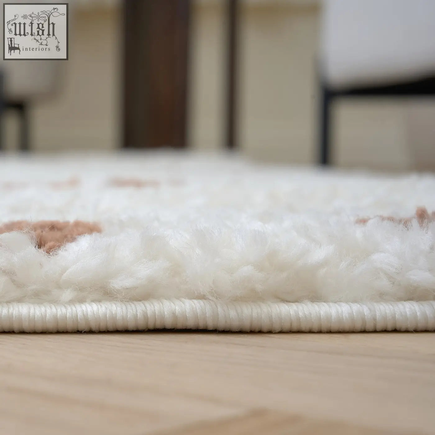 White plush moodi shaggy cream rug with soft fluffy texture and subtle pink accents on cream terra biscotti edge