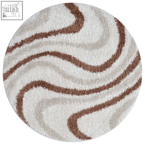 Creamy circular moodi shaggy cream rug with plush texture and flowing brown wavy stripes for cozy floors