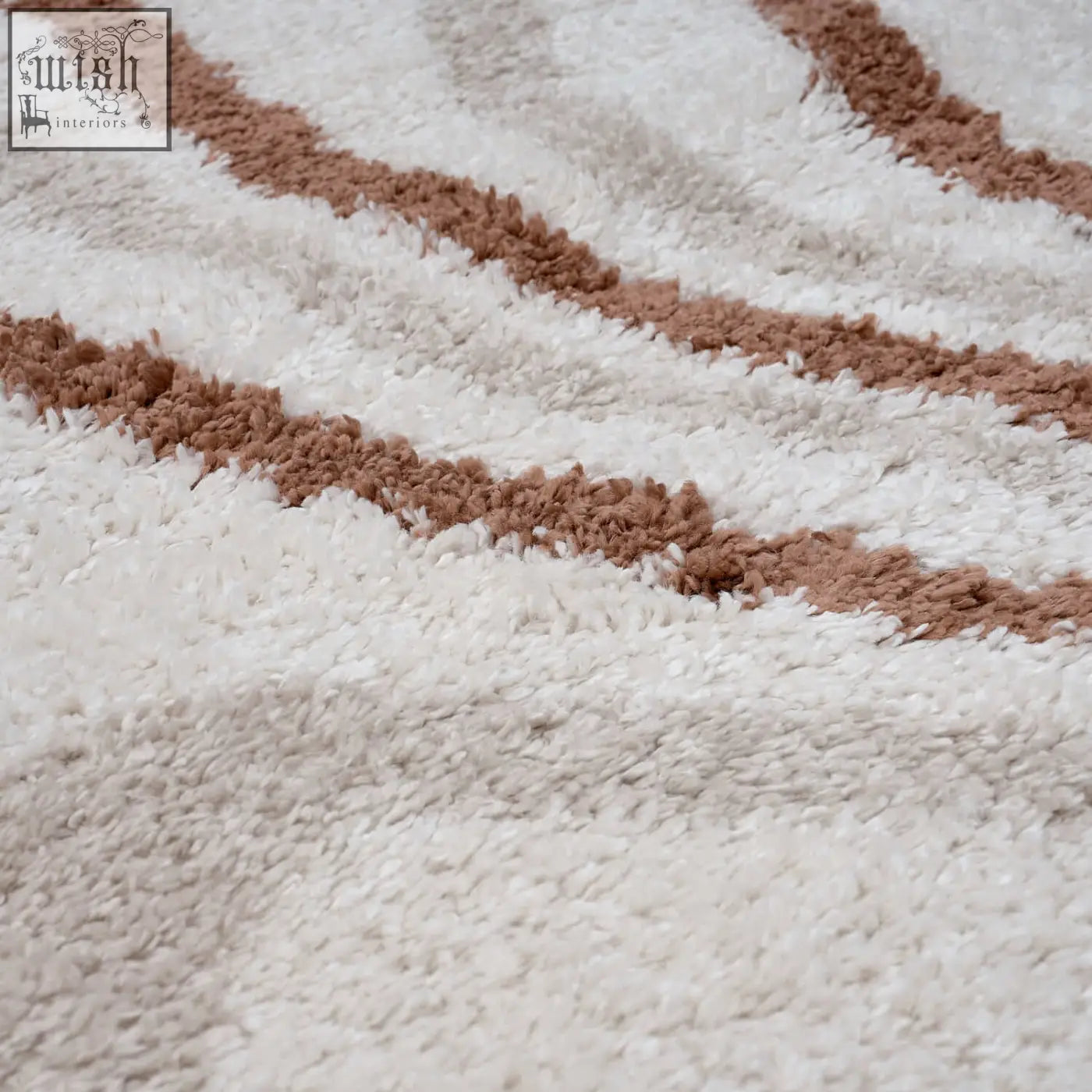 Creamy moodi shaggy cream rug with soft textured loops and wavy brown stripes perfect for cozy spaces