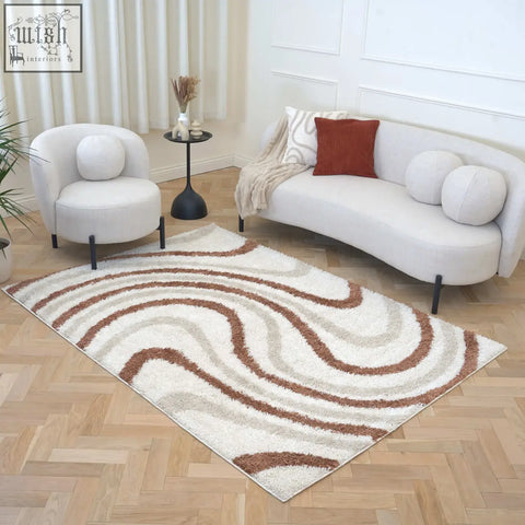 A moodi shaggy cream and terracotta wave-patterned rug with plush texture perfect for cozy living spaces