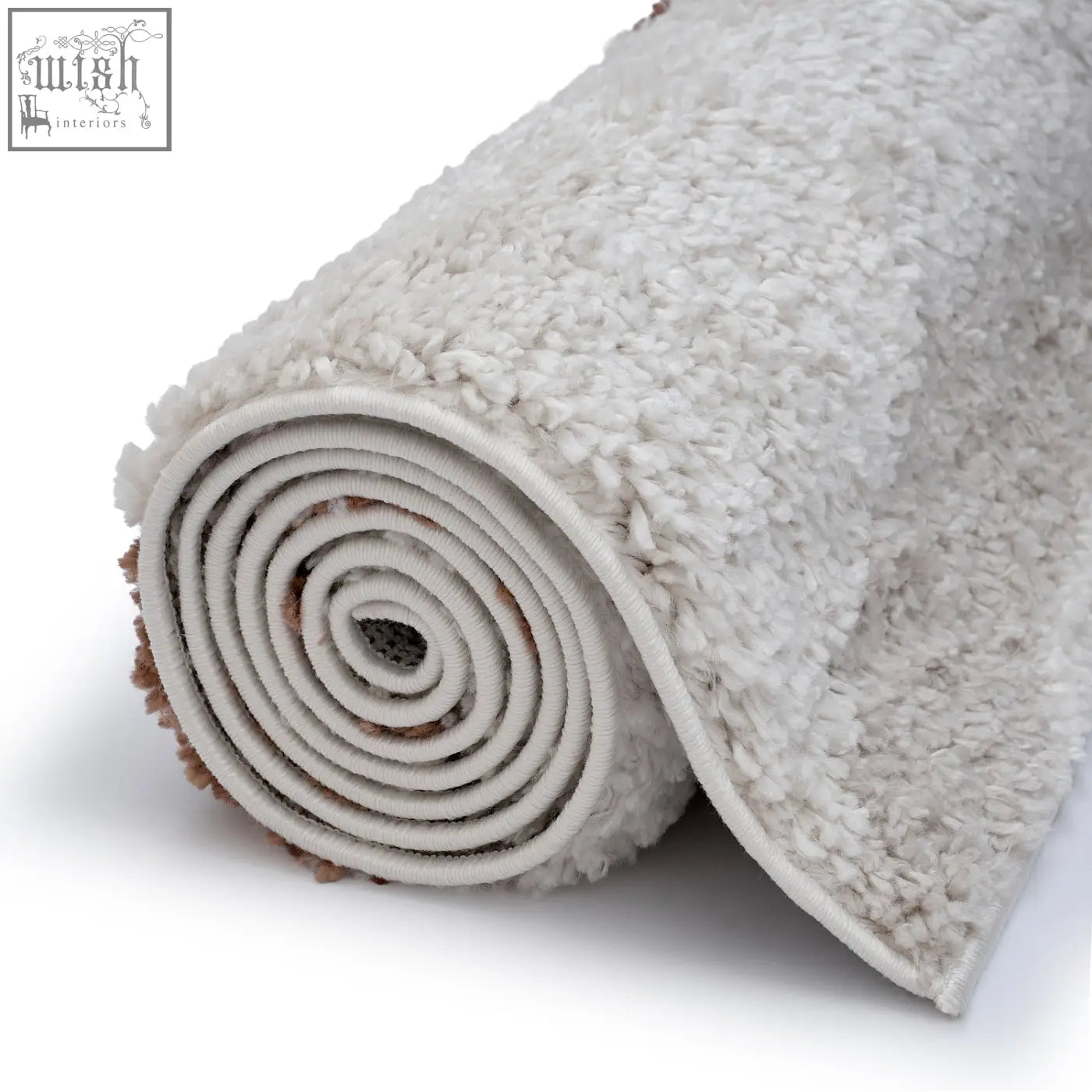 A plush moodi shaggy cream rug rolled neatly showing its soft off-white shaggy texture on a white surface