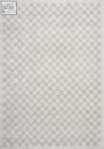 A plush moodi shaggy light beige nomari rug with a soft textured surface in light beige checkered pattern