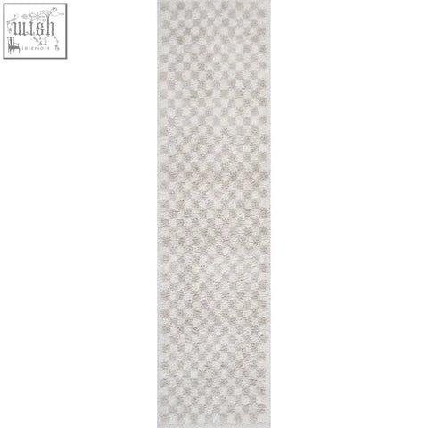 Plush moodi shaggy light beige nomari rug with subtle geometric pattern in soft light beige shaggy light beige style